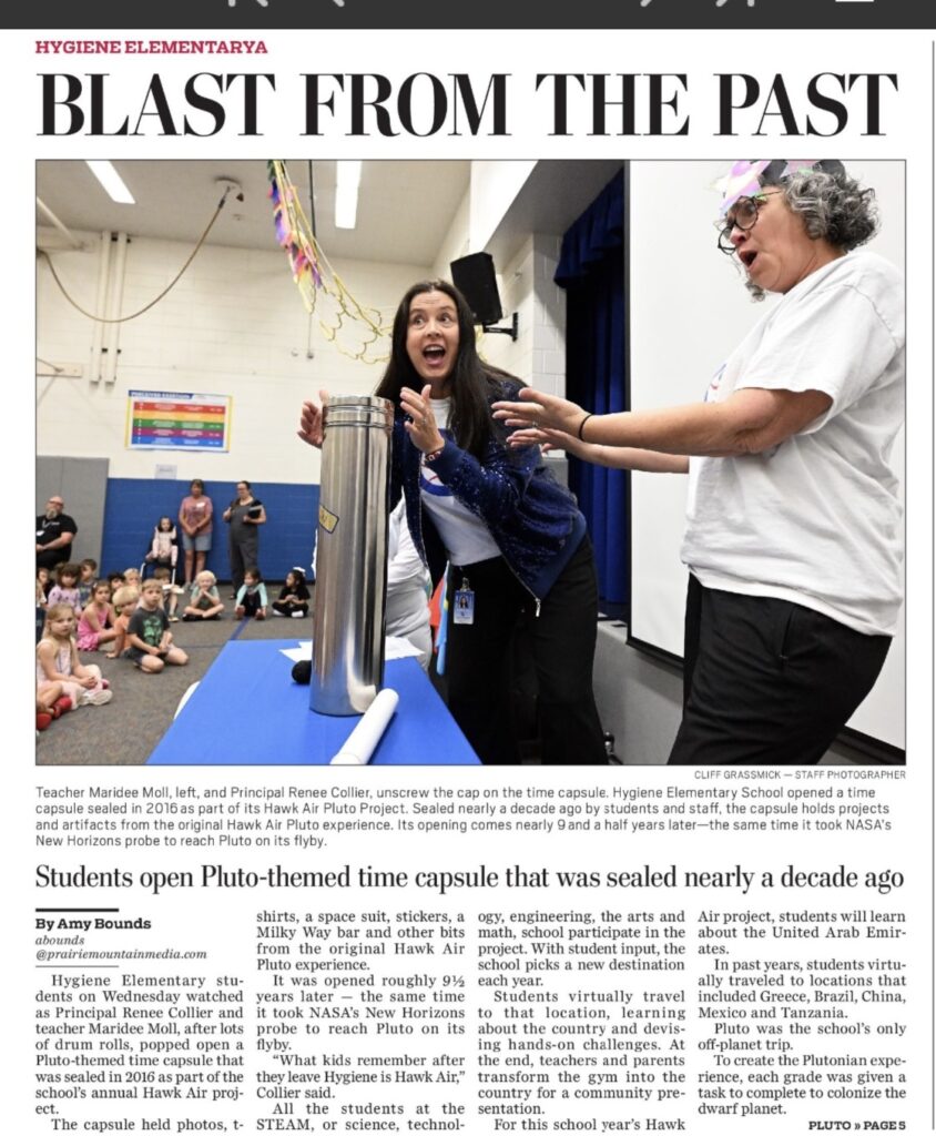 Hygiene Elementary staff unveil a time capsule, celebrating a Pluto-themed project with excited students and parents.