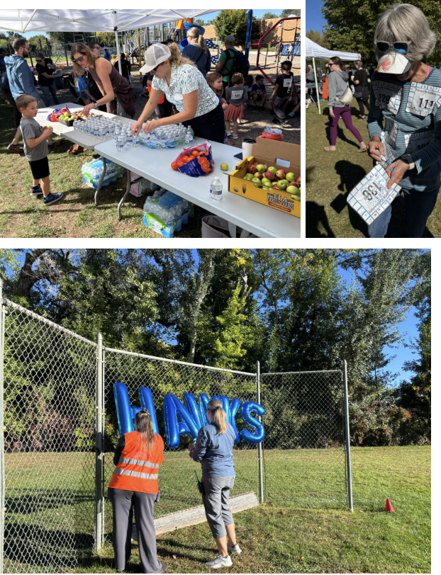 Community event with people at tables serving food and drinks, and volunteers setting up decorations on a fence.